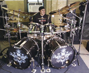 drummer Jason Bittner behind the drumkit