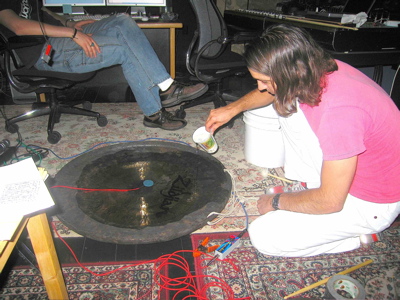 Brian Reitzel in the studio experimenting with gongs and water